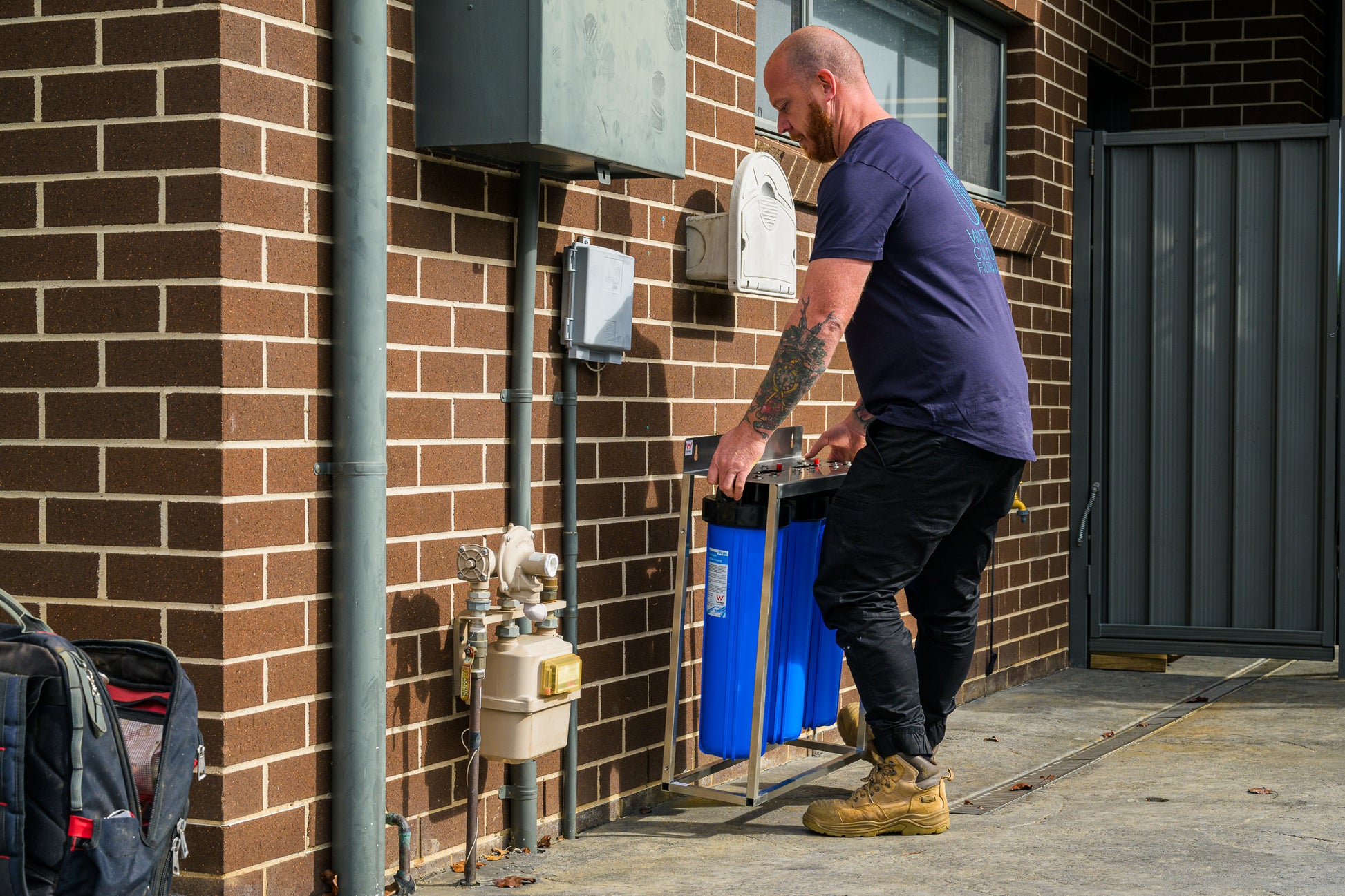 Mark from Water Culture Filtration installing a whole-house water filtration system in Harrington Park, NSW, Australia.