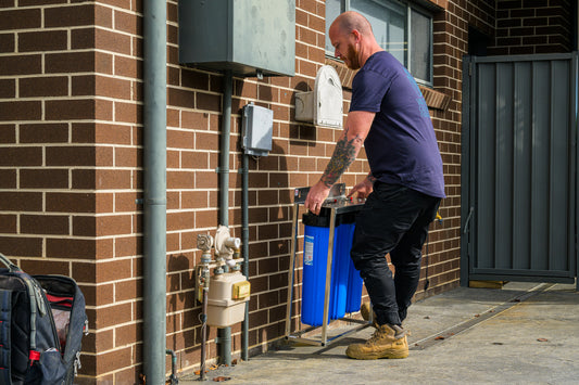 Mark from Water Culture Filtration installing a whole-house water filtration system in Harrington Park, NSW, Australia.